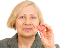 Senior Woman Holding Red Heart Stock Images