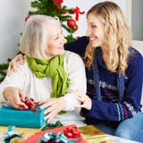 Senior woman in nursing home with gifts Royalty Free Stock Photo Senior woman in nursing home with gifts Royalty Free Stock Photo
