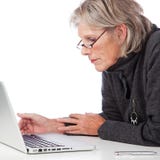 Senior woman working on a laptop stock images Senior woman working on a laptop stock images