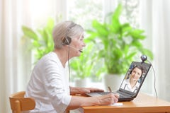 Senior woman doctor video call stock photos Senior woman doctor video call stock photos