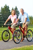 Seniors couple biking