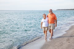 Seniors Walking on the Beach stock image Seniors Walking on the Beach stock image