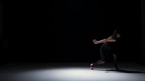 Sensual contemporary dance performance of one dancers on black, shadow stock video footage Sensual contemporary dance performance of one dancers on black, shadow stock video footage
