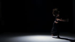 Sensual contemporary dance performance of two dancers on black, shadow stock footage Sensual contemporary dance performance of two dancers on black, shadow stock footage