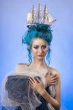 Sensual young girl with naked shoulders and painted blue hair st royalty free stock photography Sensual young girl with naked shoulders and painted blue hair st royalty free stock photography