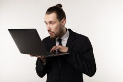 Serious bearded businessman or teacher in black suit reading post at notebook royalty free stock photos Serious bearded businessman or teacher in black suit reading post at notebook royalty free stock photos
