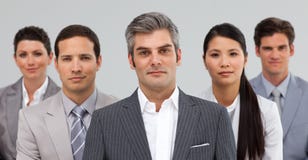 Serious busines people standing together stock image Serious busines people standing together stock image