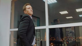 Serious businessman thinking about solve of business problem in evening office stock footage Serious businessman thinking about solve of business problem in evening office stock footage