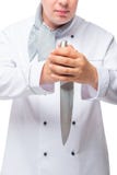 Serious cook with a very sharp knife in his hands on a white Stock Image Serious cook with a very sharp knife in his hands on a white Stock Image