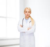 Serious female doctor with stethoscope stock image Serious female doctor with stethoscope stock image