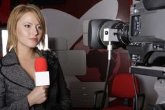 Serious TV reporter in live transmission
