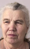 Serious woman with gray hair on her head stock image Serious woman with gray hair on her head stock image