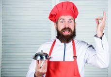 Serve food. Cuisine culinary. man holds kitchen dish tray in restaurant. Healthy food cooking. Mature hipster with beard royalty free stock photo Serve food. Cuisine culinary. man holds kitchen dish tray in restaurant. Healthy food cooking. Mature hipster with beard royalty free stock photo