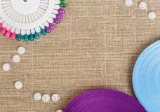 Set of colored pins with ribbons and pearls Royalty Free Stock Photos Set of colored pins with ribbons and pearls Royalty Free Stock Photos