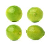 Set of four single limes in different compositions and foreshortenings, isolated over the white background Stock Images Set of four single limes in different compositions and foreshortenings, isolated over the white background Stock Images