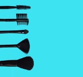 Set of makeup brushes on colored composed background stock photo Set of makeup brushes on colored composed background stock photo