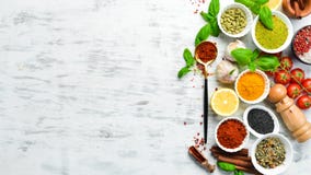 Set Of Indian Spices, Basil And Herbs On A White Wooden Background. Stock Image