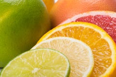 Set of sliced citrus fruits lie together as a background stock photos Set of sliced citrus fruits lie together as a background stock photos