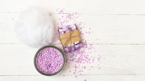 Set for spa treatments. Bath salt a piece of natural soap sponge washcloth stacked on a light background. Flat layout. royalty free stock photos Set for spa treatments. Bath salt a piece of natural soap sponge washcloth stacked on a light background. Flat layout. royalty free stock photos