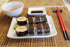 Set of sushi rolls on bamboo mat stock photos Set of sushi rolls on bamboo mat stock photos