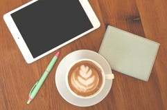 Flat lay of coffee, tablet, pen and notepad. stock photography Flat lay of coffee, tablet, pen and notepad. stock photography