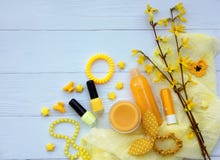 Set of yellow accessories for young girl or teenager. Nail polishes, lipstick, hair clips, bands, beads, bracelet, perfume and fl stock photography Set of yellow accessories for young girl or teenager. Nail polishes, lipstick, hair clips, bands, beads, bracelet, perfume and fl stock photography