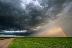 Sunset Casting Light on a Departing Thunderstorm royalty free stock photography Sunset Casting Light on a Departing Thunderstorm royalty free stock photography