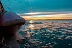 The setting sun illuminates the blue water of the lake. royalty free stock photo The setting sun illuminates the blue water of the lake. royalty free stock photo