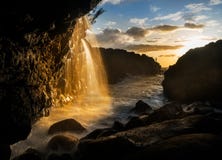 Waterfall near Queens Bath in Princeville Kauai Royalty Free Stock Photo Waterfall near Queens Bath in Princeville Kauai Royalty Free Stock Photo