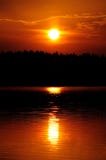 Setting Sun With Ray Path Of Light On Water Royalty Free Stock Photos