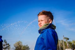 Seven-year-old boy in a scarf against the blue sky stock photos Seven-year-old boy in a scarf against the blue sky stock photos