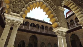 Seville, Andalucia, Spain - April 18, 2016: Alcazar, indoor gardens, courtyards and rooms