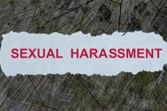 Sexual harassment word on a cut out newspaper Royalty Free Stock Photos Sexual harassment word on a cut out newspaper Royalty Free Stock Photos