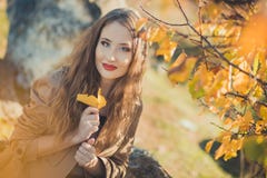 Amazing lady girl nifty stylish dressed in autumn jacket with blond hairs and pout red lips with make up face posing sit for. Camera in central park spring royalty free stock photos Amazing lady girl nifty stylish dressed in autumn jacket with blond hairs and pout red lips with make up face posing sit for. Camera in central park spring royalty free stock photos