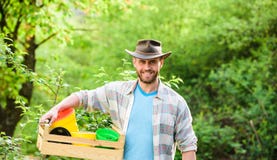 Sexy farmer hold wooden box with pot. Eco farm worker. Harvest. happy earth day. Eco living. farming and agriculture royalty free stock photo Sexy farmer hold wooden box with pot. Eco farm worker. Harvest. happy earth day. Eco living. farming and agriculture royalty free stock photo