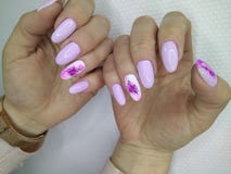 Sexy pink manicure. On long beautiful nails woman makeup beauty lips girl fashion face model color african lipstick background glamour salon polish black hand stock images Sexy pink manicure. On long beautiful nails woman makeup beauty lips girl fashion face model color african lipstick background glamour salon polish black hand stock images
