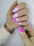 Sexy pink manicure. On long beautiful nails woman makeup beauty lips girl fashion face model color african lipstick background glamour salon polish black hand royalty free stock images Sexy pink manicure. On long beautiful nails woman makeup beauty lips girl fashion face model color african lipstick background glamour salon polish black hand royalty free stock images