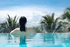 woman in bikini swimming suit relaxing in the luxury pool stock images woman in bikini swimming suit relaxing in the luxury pool stock images