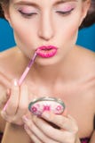 Sexy young pin-up girl doing make-up Stock Photos Sexy young pin-up girl doing make-up Stock Photos