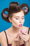 Sexy young pin-up girl doing make-up Stock Images Sexy young pin-up girl doing make-up Stock Images