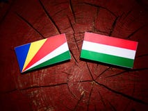 Seychelles flag with Hungarian flag on a tree stump isolated stock illustration Seychelles flag with Hungarian flag on a tree stump isolated stock illustration