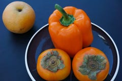 Fruit and vegetable still life in orange and black tones stock photo Fruit and vegetable still life in orange and black tones stock photo
