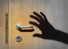 Shadow of a burglar breaking into a house royalty free stock images Shadow of a burglar breaking into a house royalty free stock images