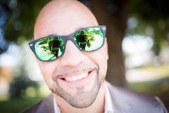Shallow Focus Photography of Man in Gray Top Wearing Green Sunglasses With Black Frames Stock Image Shallow Focus Photography of Man in Gray Top Wearing Green Sunglasses With Black Frames Stock Image