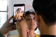 SHANGHAI, CHINA: July 2018: A New Medical App Being Developed In China Is Being Tested On A Female Patient Stock Photos
