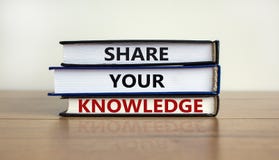 Share your knowledge symbol. Books with words `share your knowledge` on beautiful wooden table. White background. Business and