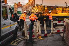 SHEFFIELD, ENGLAND - OCTOBER 13TH, 2018: Construction crews repair a road in Kelham Island, Sheffield stock photos SHEFFIELD, ENGLAND - OCTOBER 13TH, 2018: Construction crews repair a road in Kelham Island, Sheffield stock photos