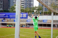 Shenzhen, China: no fósforo de futebol em curso imagens de stock Shenzhen, China: no fósforo de futebol em curso imagens de stock