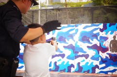 Shenzhen, China: police open day activities, citizens pistol firing experience Stock Photo Shenzhen, China: police open day activities, citizens pistol firing experience Stock Photo