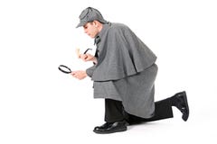 Sherlock: Detektyw Używa Powiększać - szkło Egzamininować Coś zdjęcie stock Sherlock: Detektyw Używa Powiększać - szkło Egzamininować Coś zdjęcie stock